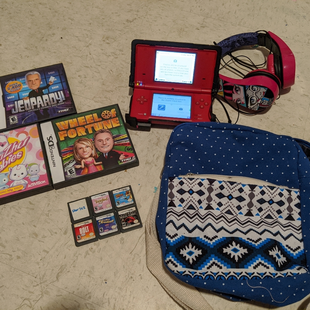 Red Nintendo DSI with games+ accessories